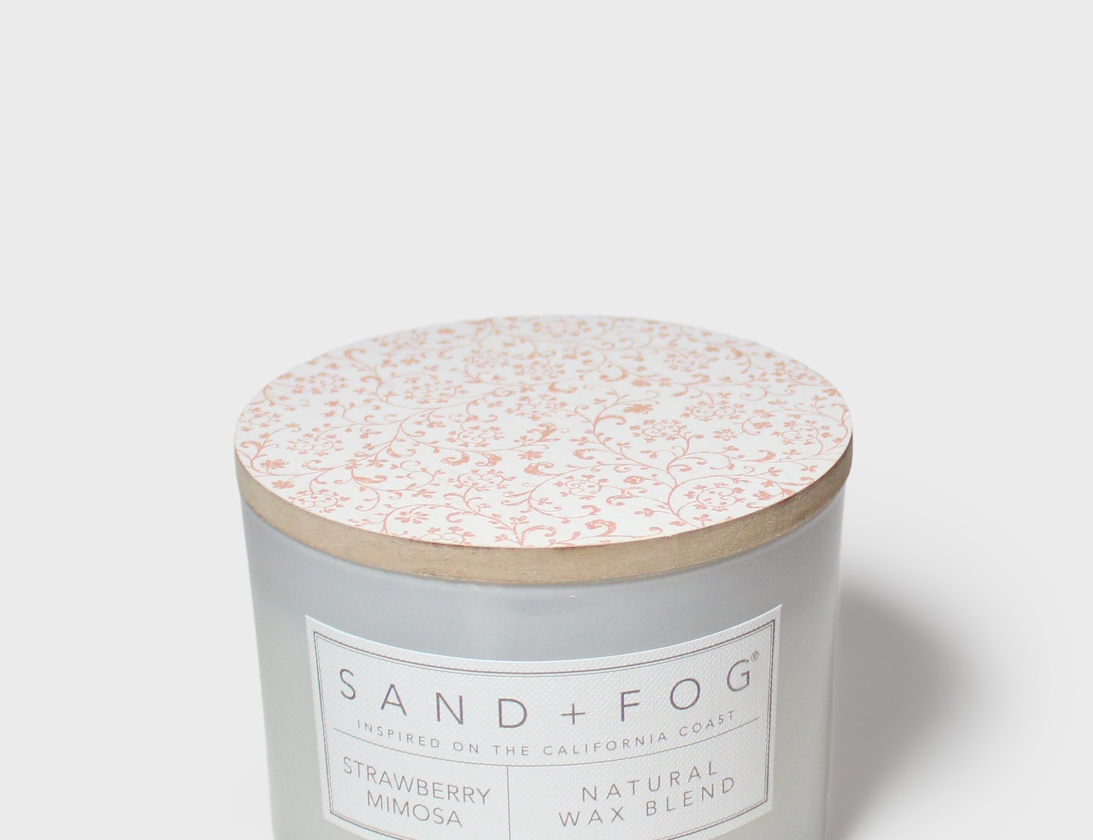 Frosted glass 12 oz scented candle with patterned lid and front label
