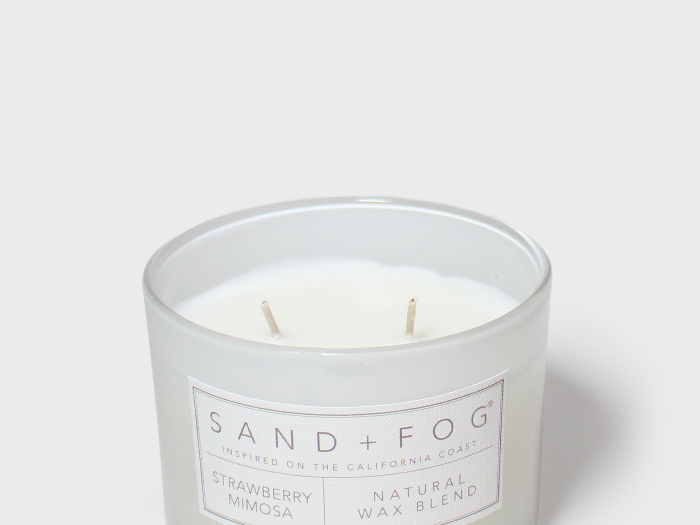 12 oz scented candle in frosted glass jar with two wicks and white label