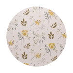 Round beige candle lid with botanical illustration in muted greens and golden flowers