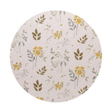 Round beige candle lid with botanical illustration in muted greens and golden flowers