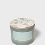 Scented candle jar with pastel botanical lid top, Sand+Fog label