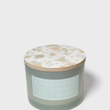 Scented candle jar with pastel botanical lid top, Sand+Fog label