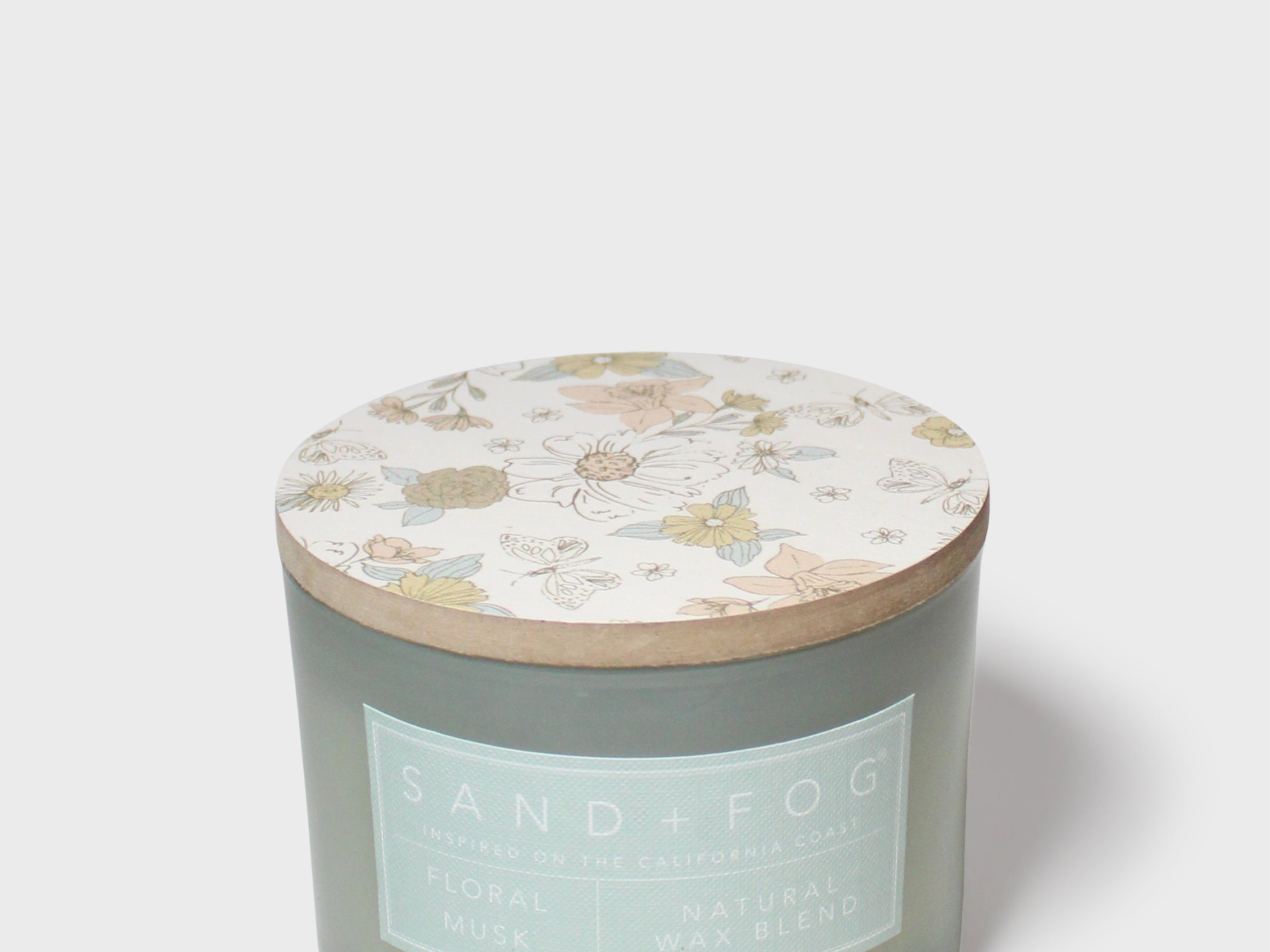 Scented candle jar with pastel botanical lid top, Sand+Fog label