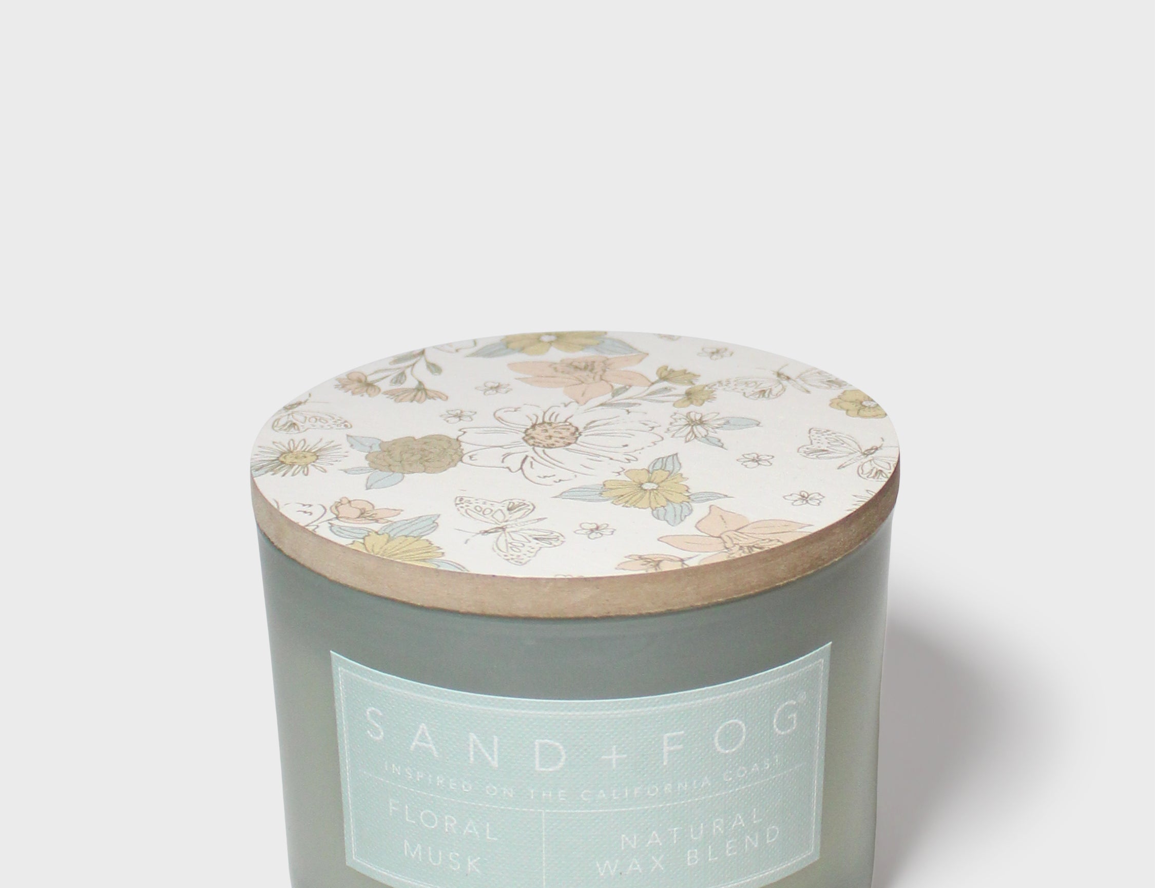 Scented candle jar with pastel botanical lid top, Sand+Fog label