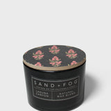 Scented candle in black jar with wood lid and pink floral print top