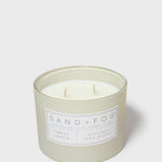 Sand + Fog scented candle in glass jar with Sweet Lemon label