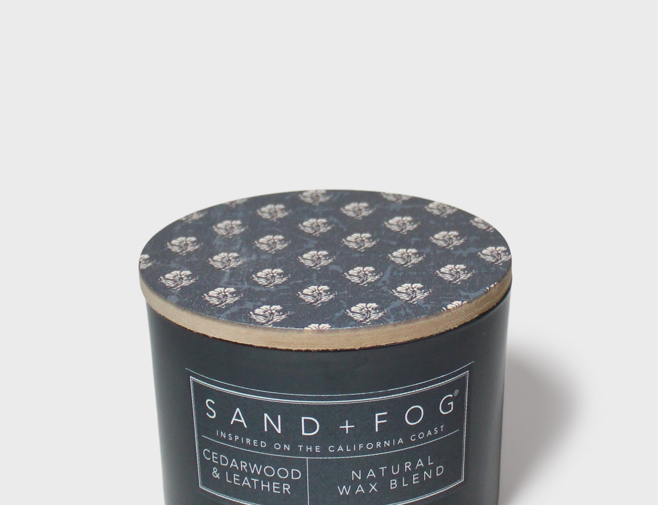 12 oz scented candle jar with patterned lid top and cedarwood & leather label