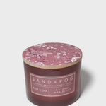 Rose & Oak scented candle with pink floral wax lid and natural blend label on jar