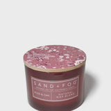 Rose & Oak scented candle with pink floral wax lid and natural blend label on jar