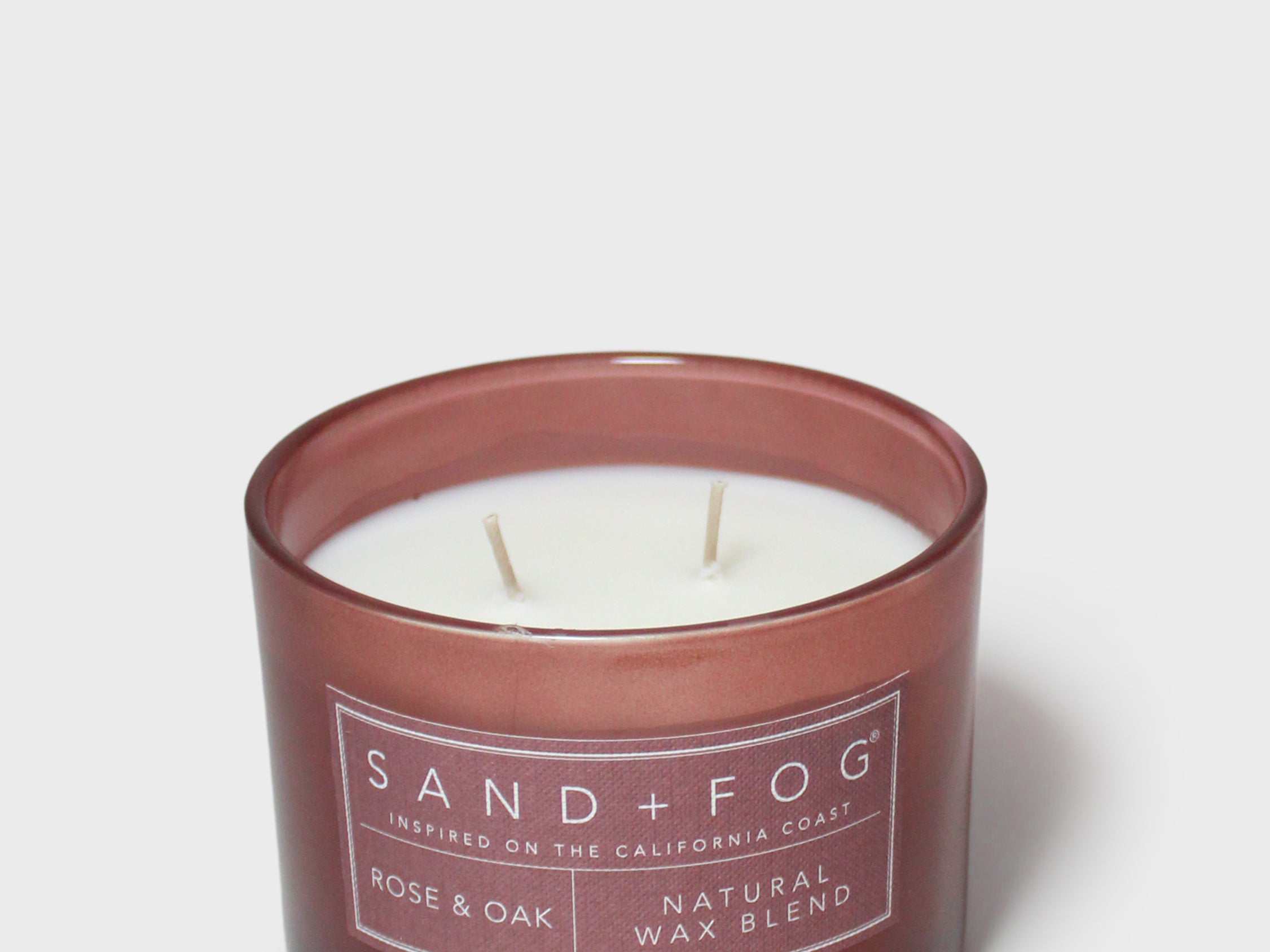 Rose & Oak 12 oz scented candle in brown glass jar with label and visible wicks