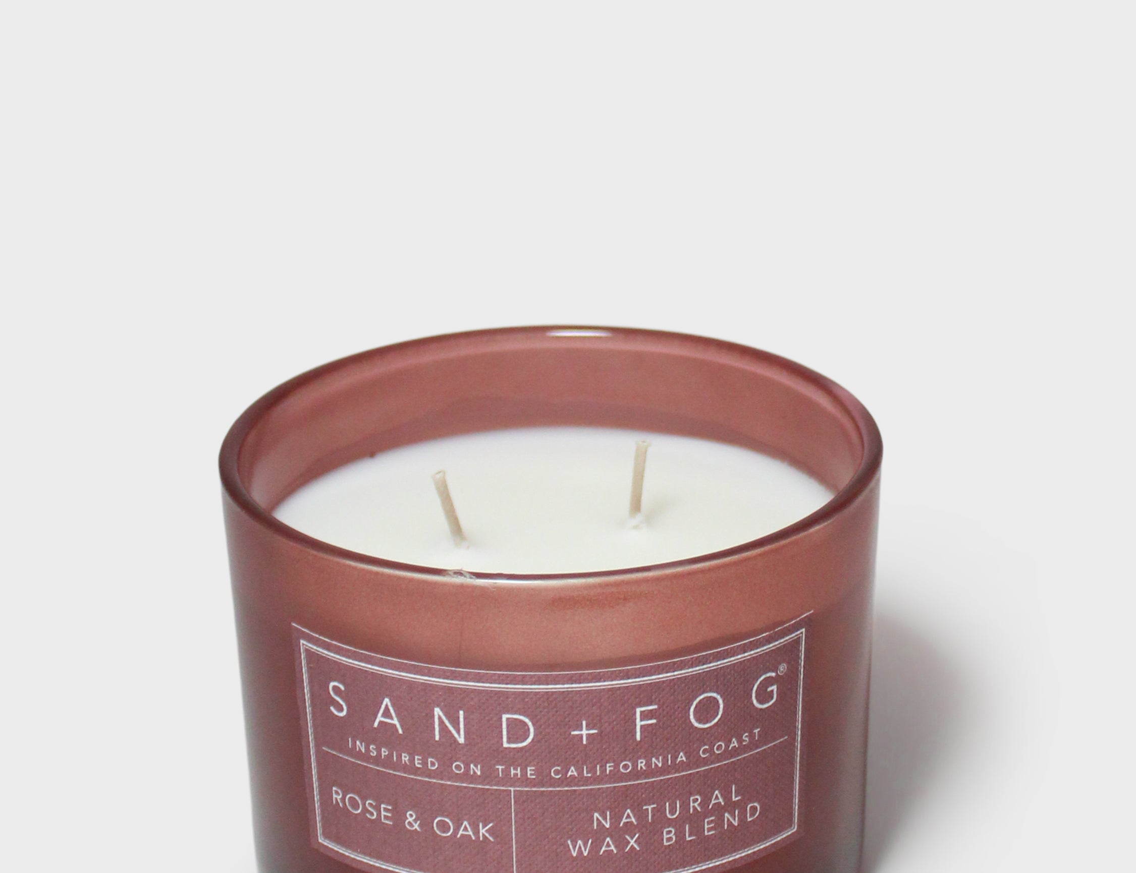 Rose & Oak 12 oz scented candle in brown glass jar with label and visible wicks