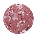 Scented candle wax top with pink floral botanical pattern on dark surface