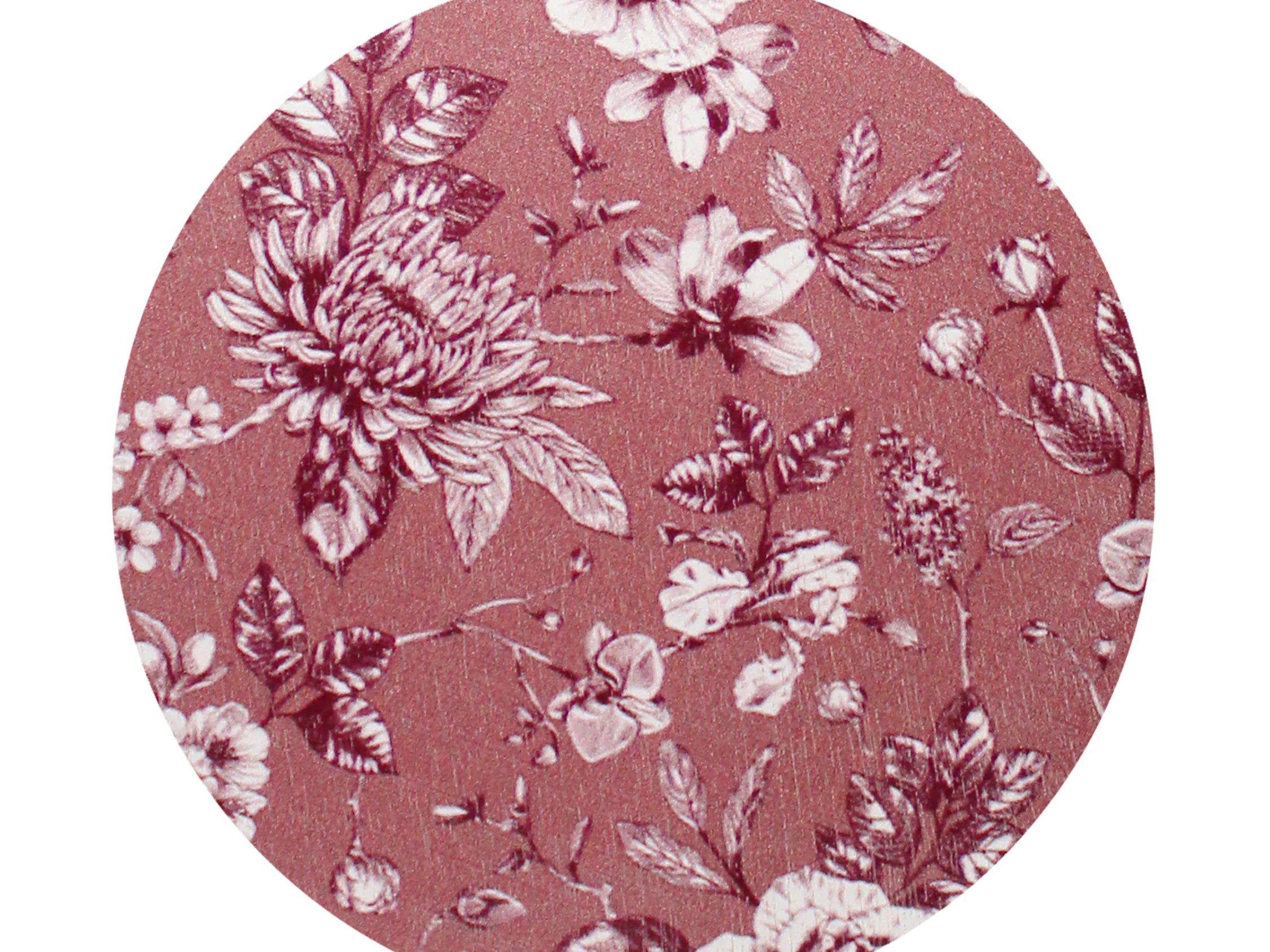 Scented candle wax top with pink floral botanical pattern on dark surface