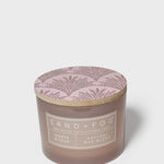 Sand+Fog Amber & Pear candle jar with round lid featuring purple botanical branches