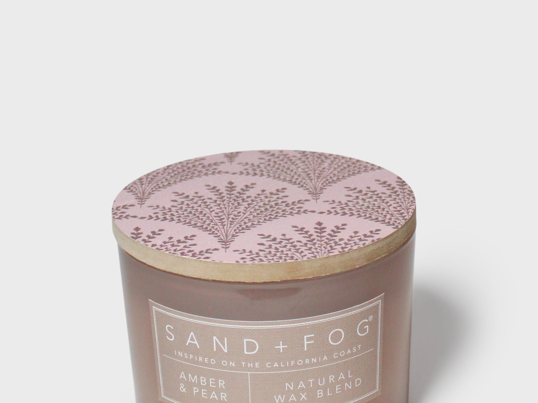 Sand+Fog Amber & Pear candle jar with round lid featuring purple botanical branches