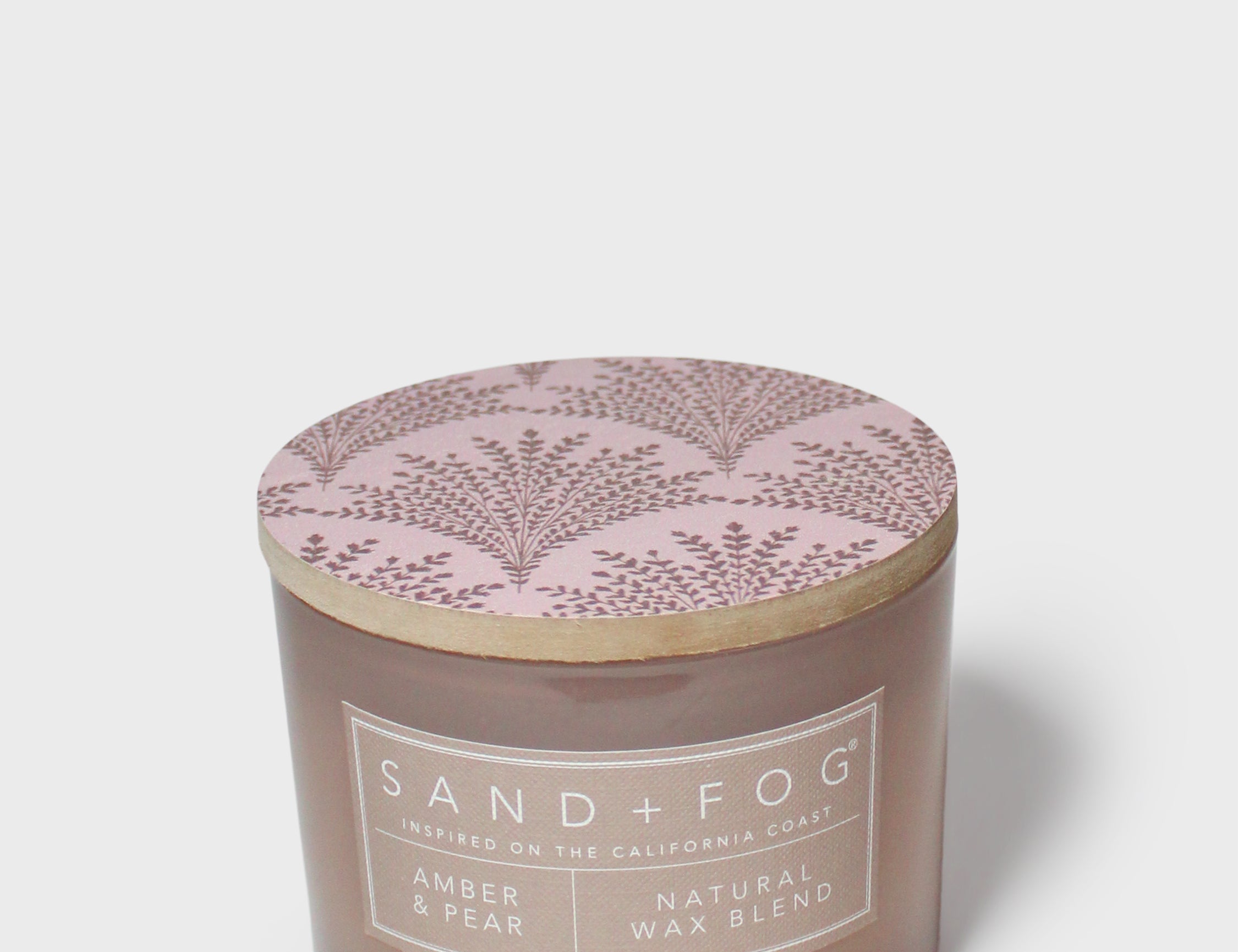 Sand+Fog Amber & Pear candle jar with round lid featuring purple botanical branches