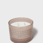 Sand+Fog Amber & Pear 12 oz candle in frosted brown glass with three wicks