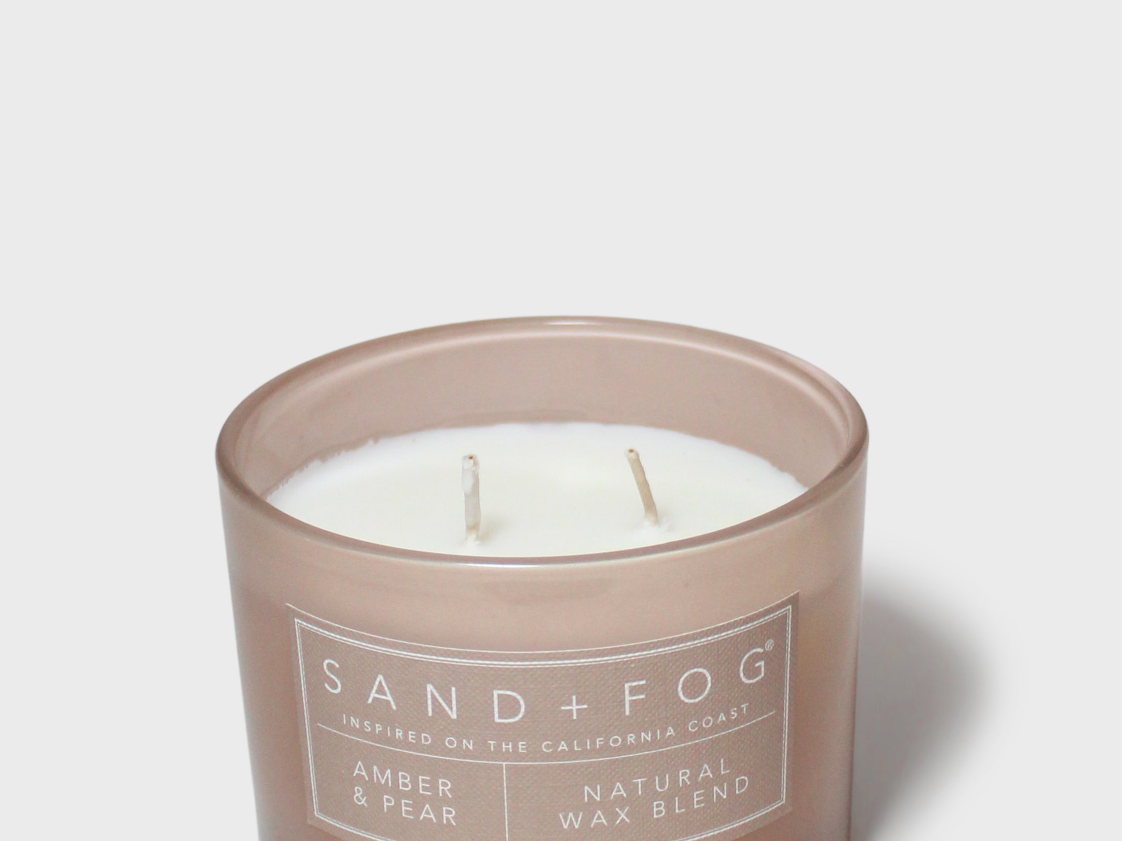 Sand+Fog Amber & Pear 12 oz candle in frosted brown glass with three wicks