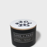 Black scented candle jar with plaid paw label and cedar lavender scent text