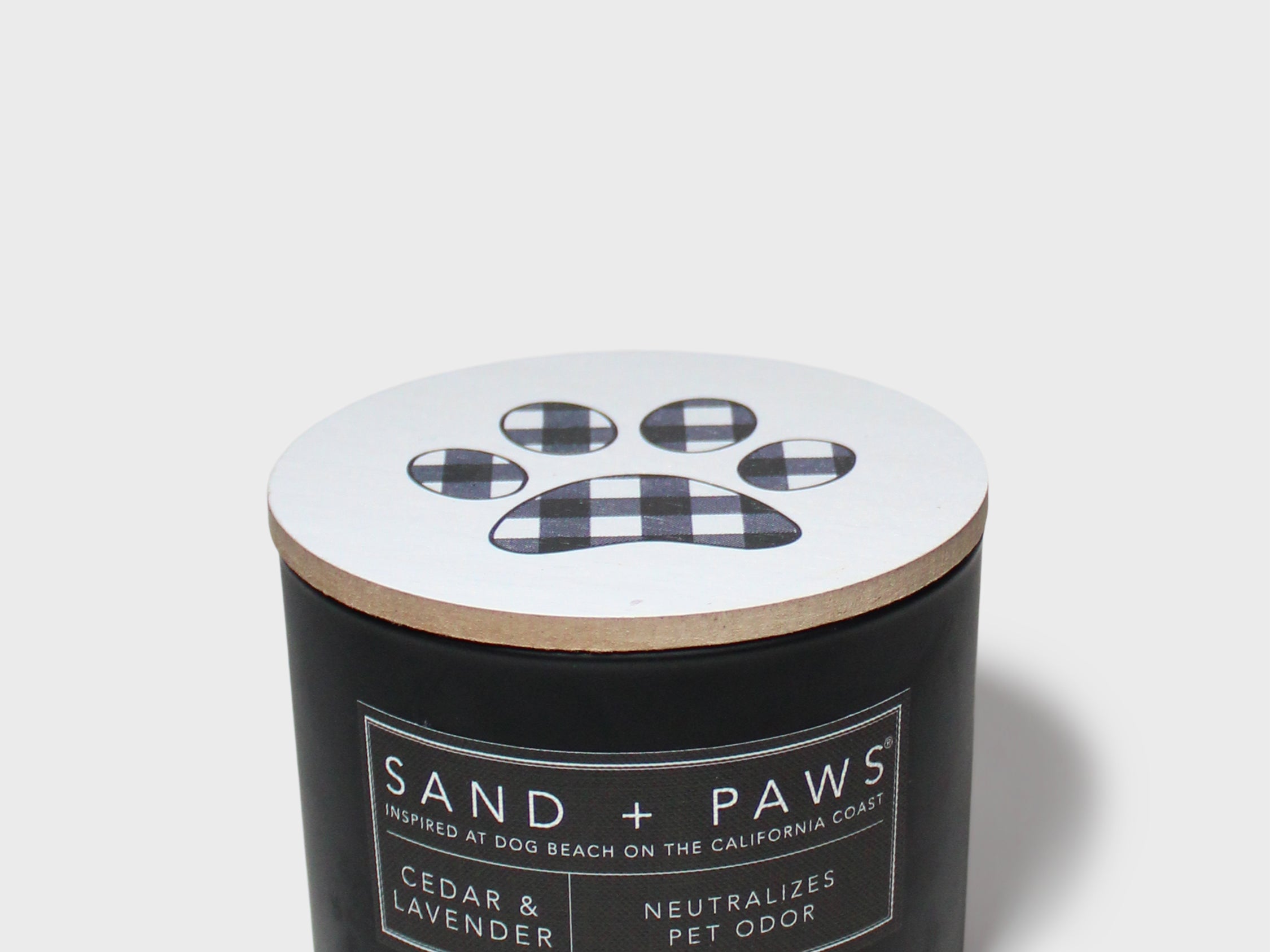 Black scented candle jar with plaid paw label and cedar lavender scent text