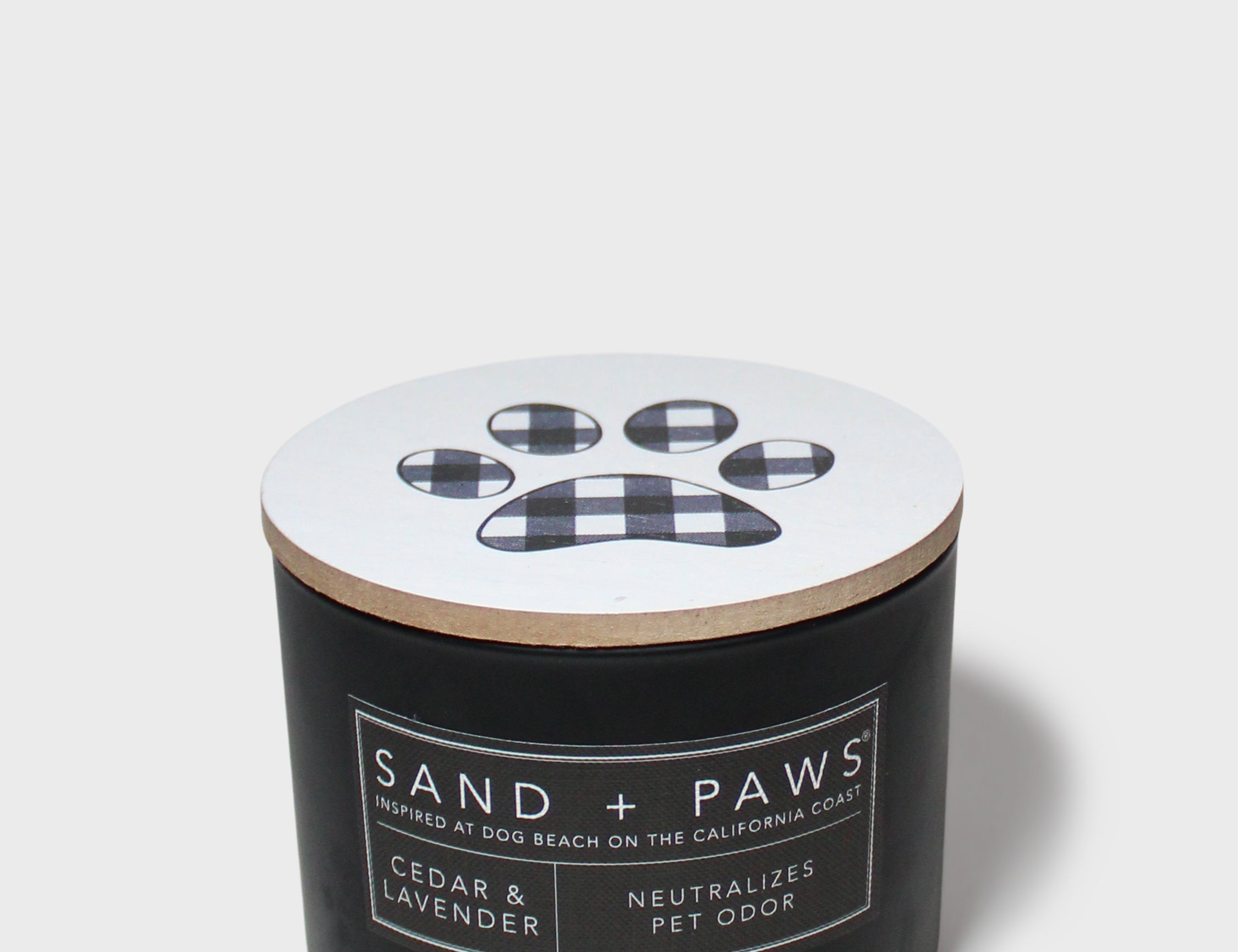 Black scented candle jar with plaid paw label and cedar lavender scent text