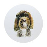 Scented candle with white lid graphic of a curly-haired dog portrait