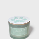 Scented candle jar lid with pale paw-print design on light white top
