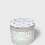 Sand + Paws white cotton scented candle with wood lid and blue dog pattern