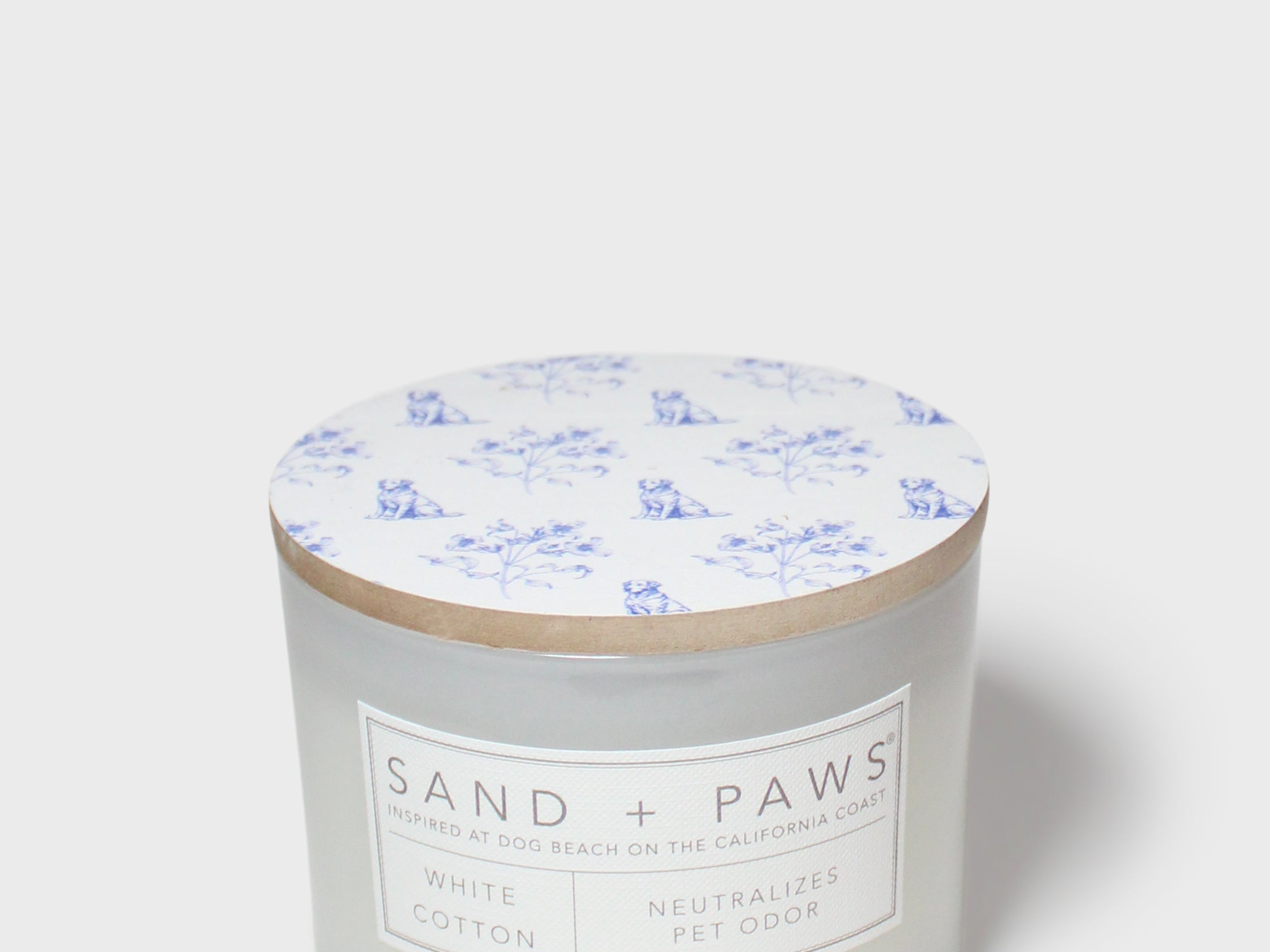 Sand + Paws white cotton scented candle with wood lid and blue dog pattern