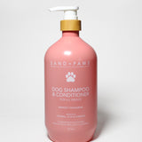 Pink pet shampoo & conditioner bottle with white pump, Sand + Paws label, mango tangerine