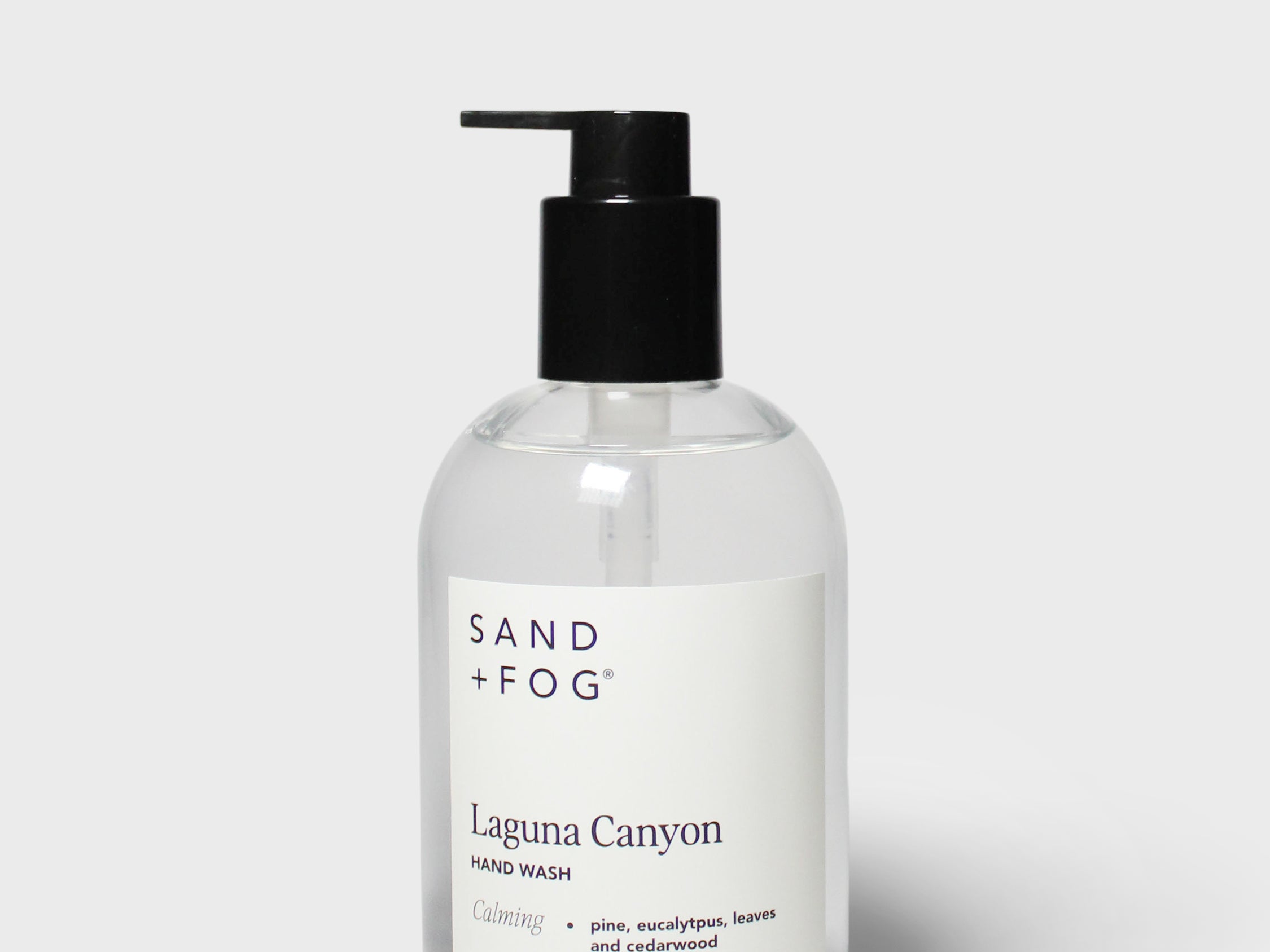 Clear foaming hand soap bottle with black pump, Laguna Canyon label, SAND + FOG