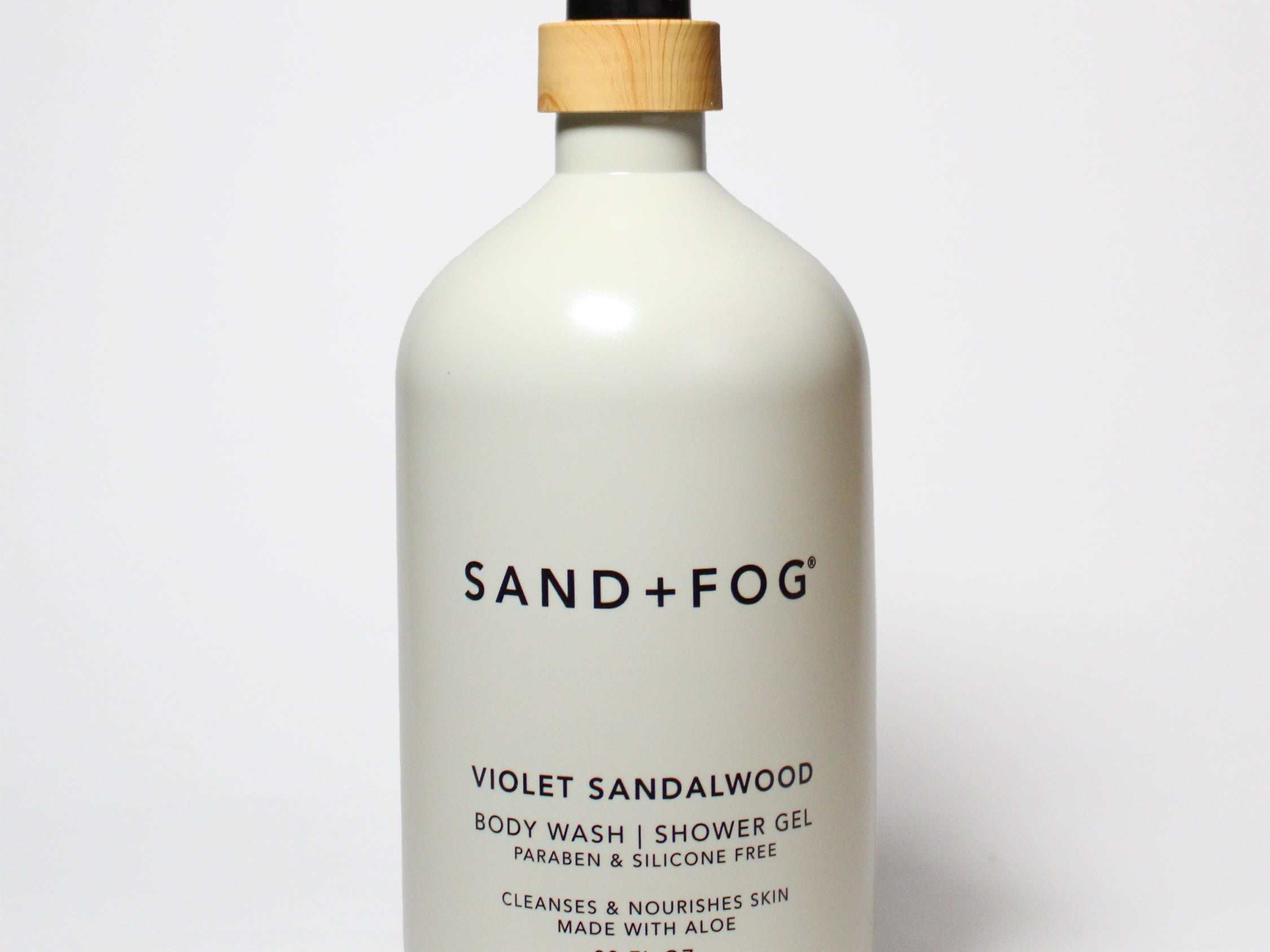 SAND+FOG violet sandalwood body wash bottle with black pump and tan/gold cap