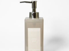 Liquid hand soap bottle with metal pump, beige translucent liquid, Sand + Fog label