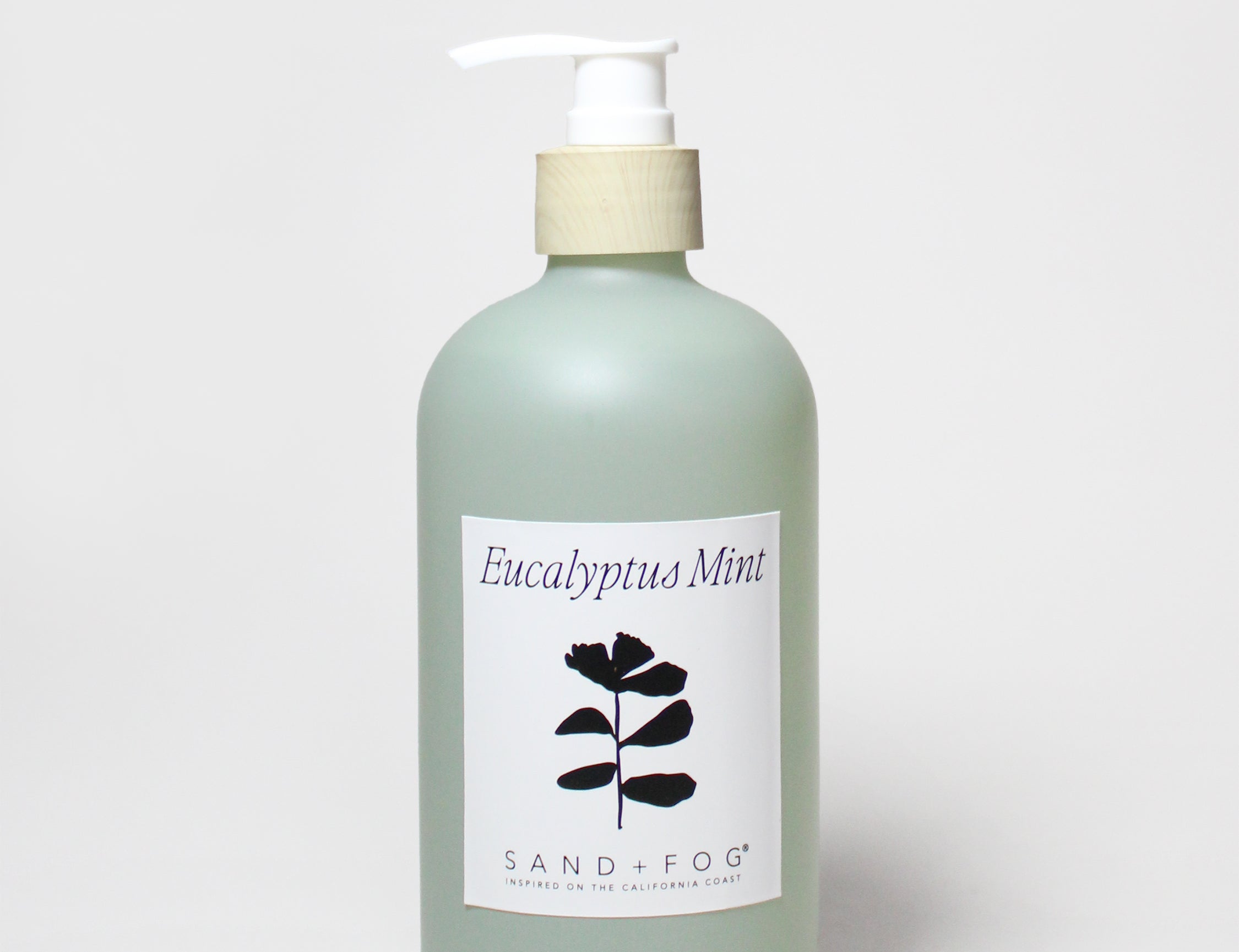 Liquid hand soap bottle with pump, Sand+Fog eucalyptus mint label.