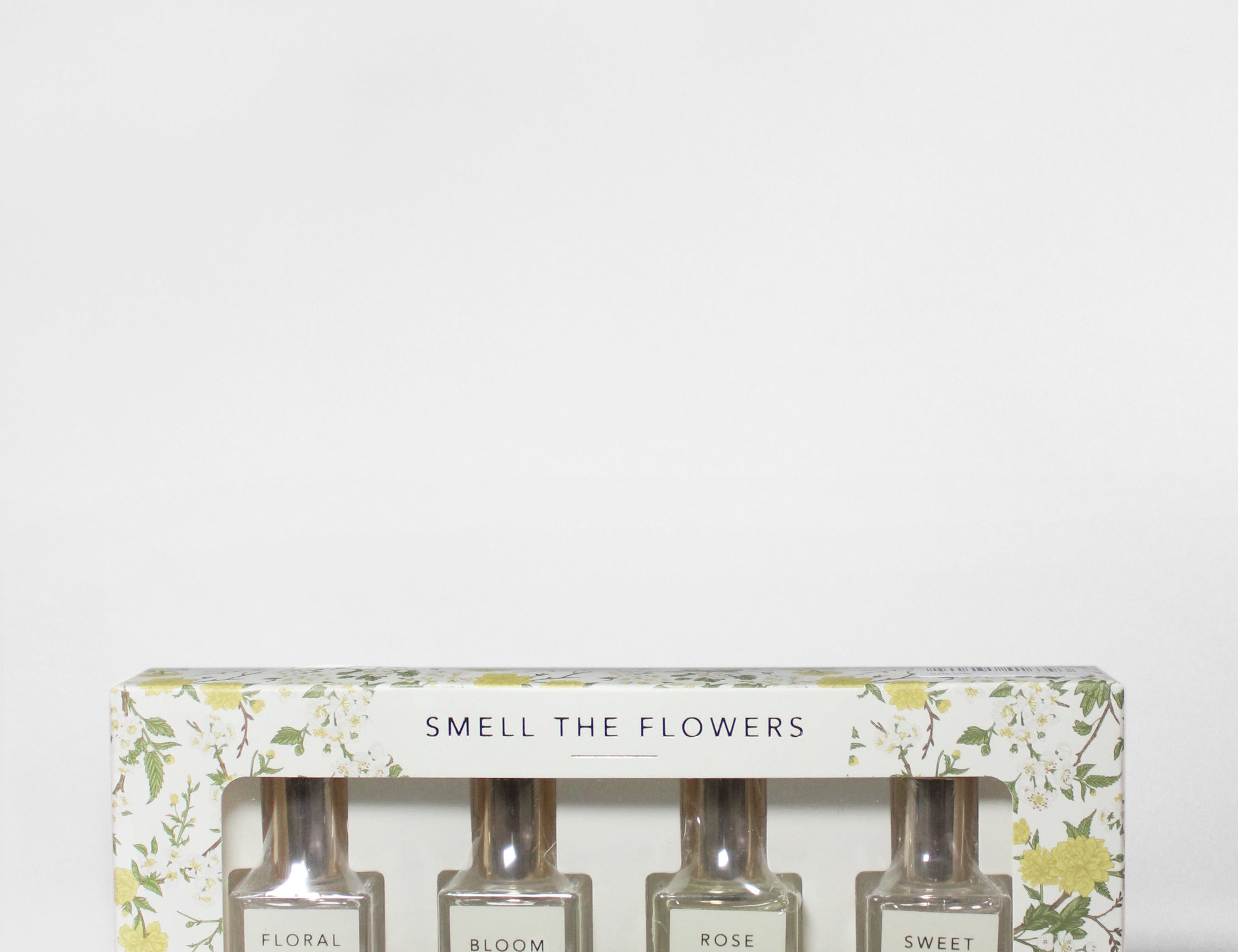 Perfume oil rollerball set in floral box, “Smell the Flowers” with 4 bottle labels