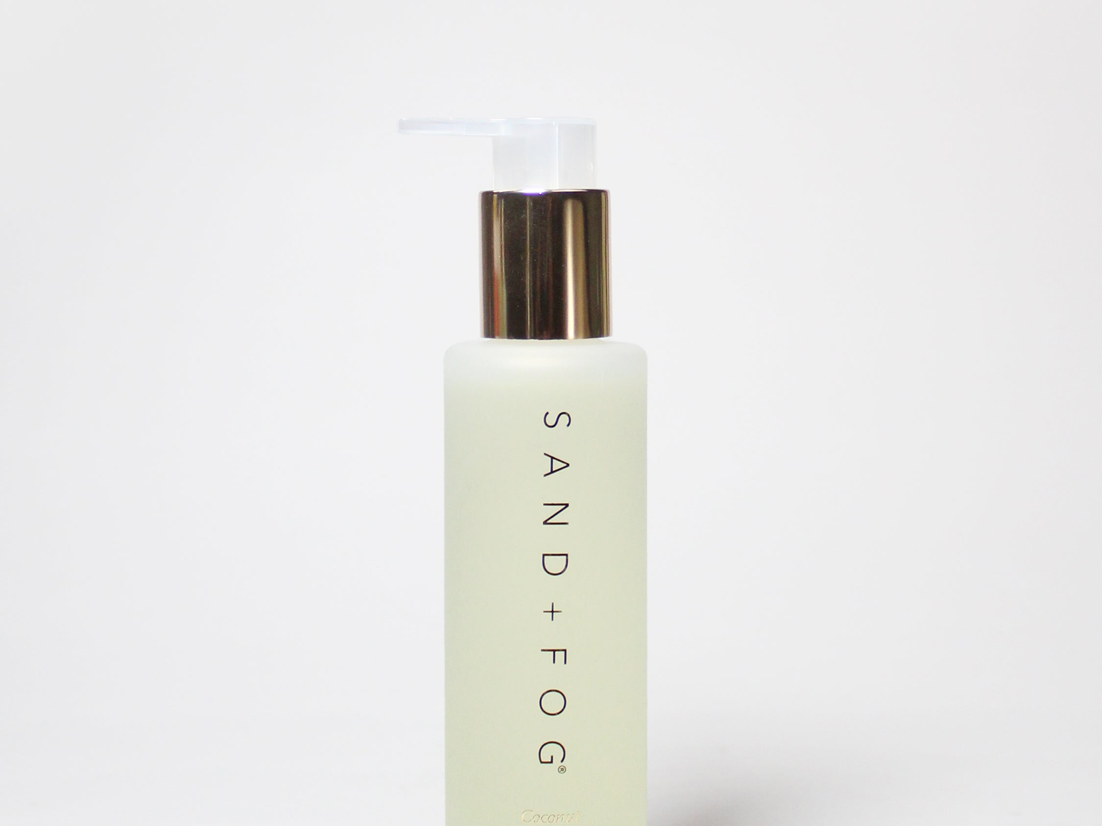 Sand+Fog Coconut Crème body oil bottle with pump dispenser