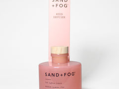 Reed diffuser set with pink jar and matching box packaging, reed sticks visible