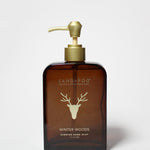 Amber glass liquid hand soap bottle with gold pump; Winter Woods scent