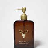 Amber glass liquid hand soap bottle with gold pump; Winter Woods scent