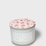 Scented candle with patterned top lid and front label