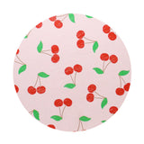 Scented candle lid with red cherry and green leaf pattern
