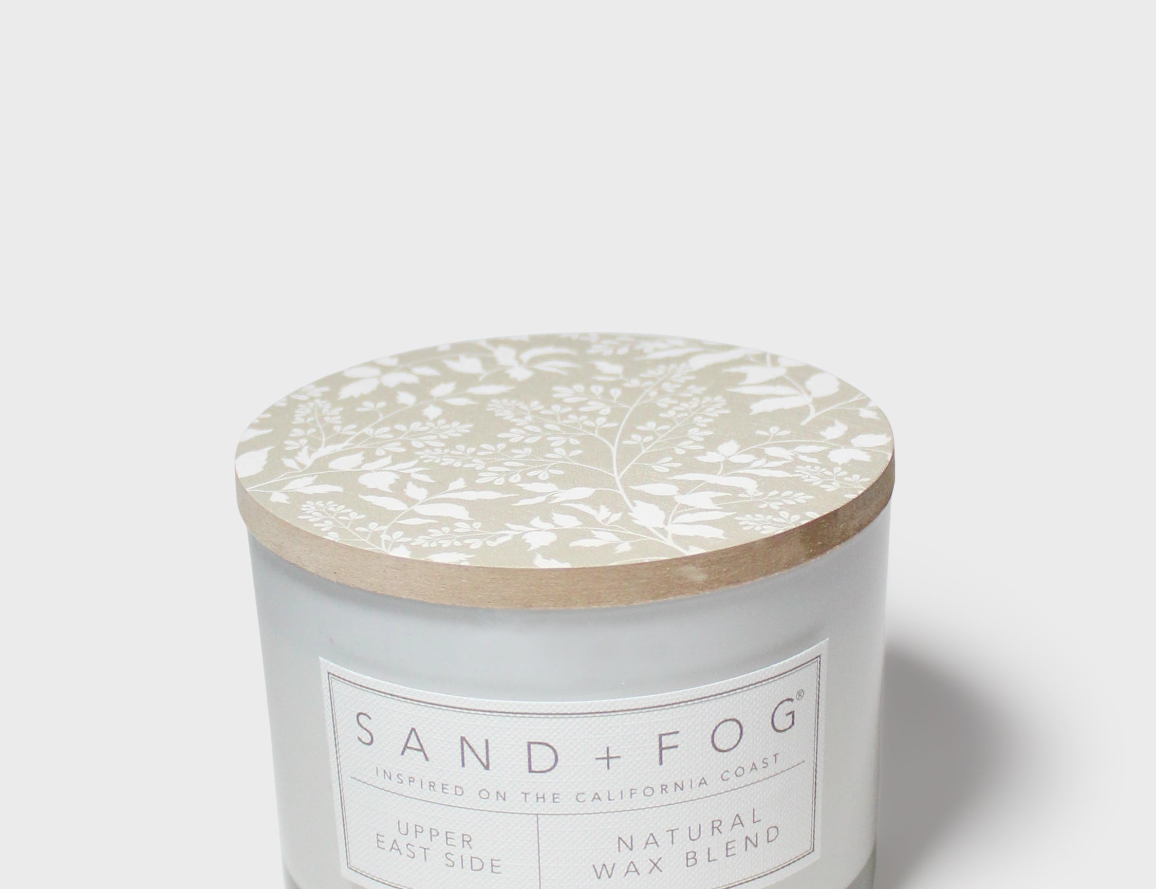 SAND+FOG scented candle jar with beige botanical lid and Natural Wax Blend label