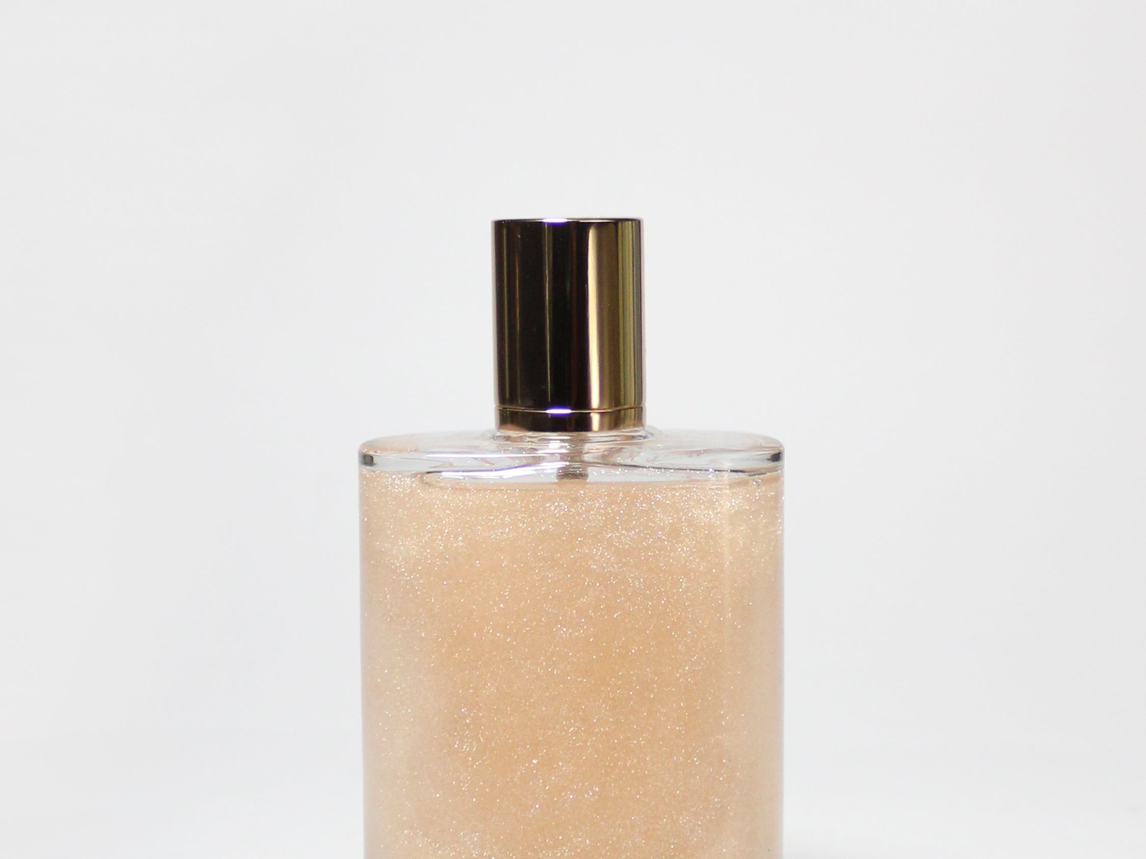 Glass perfume body oil bottle with gold cap, amber liquid, Sweet Honey scent