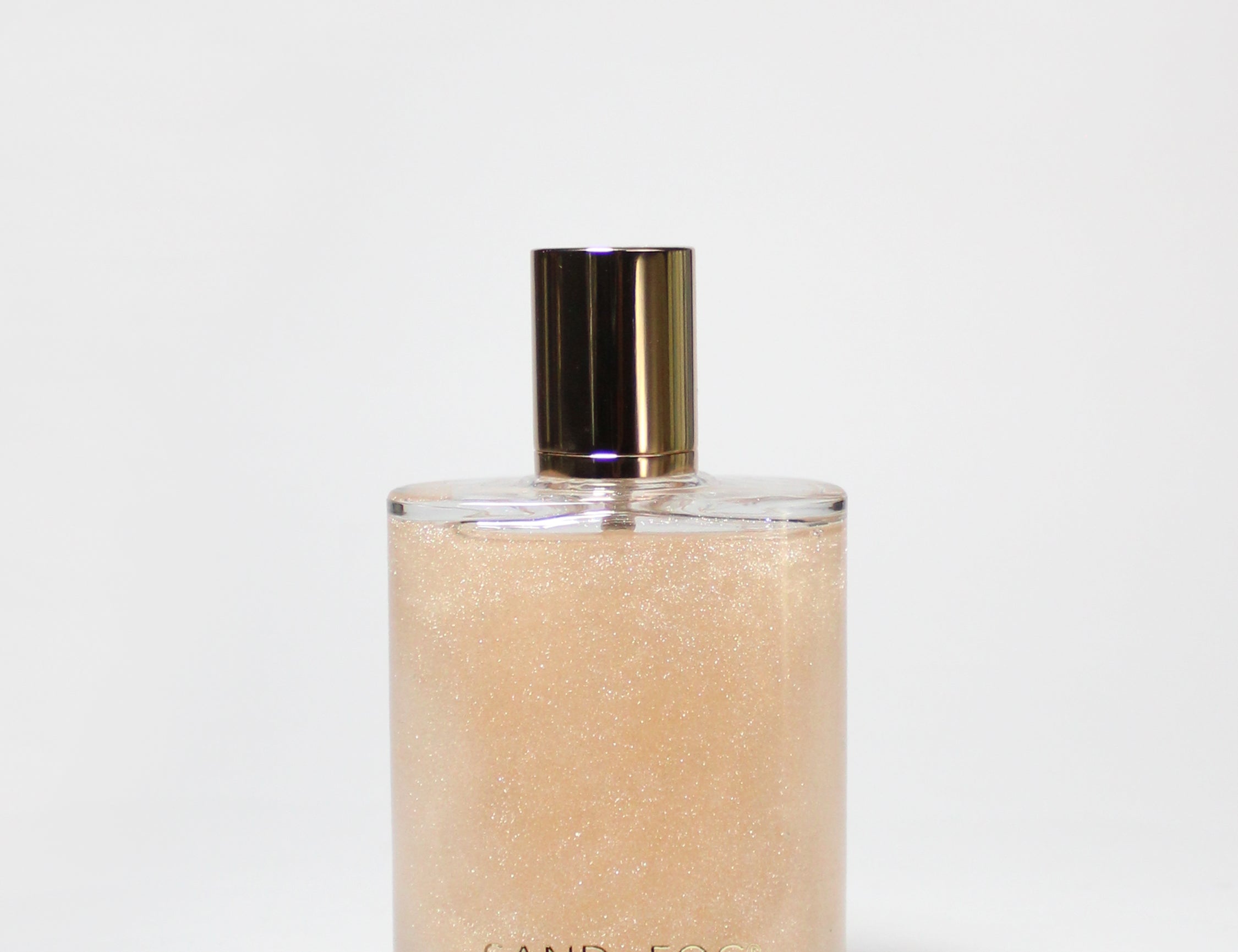 Glass perfume body oil bottle with gold cap, amber liquid, Sweet Honey scent