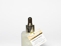 Vanilla milk perfume oil bottle with glass dropper and small branded card